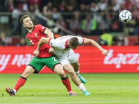 Diogo Jota , Pawel Dawidowicz  during UEFA Nations League match Poland vs Portugal in Warsaw Poland on 12 October 2024. (