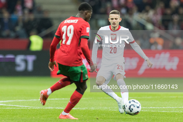 Nuno Mendes , Sebastian Szymanski  during UEFA Nations League match Poland vs Portugal in Warsaw Poland on 12 October 2024. 