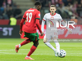 Nuno Mendes , Sebastian Szymanski  during UEFA Nations League match Poland vs Portugal in Warsaw Poland on 12 October 2024. (