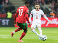 Nuno Mendes , Sebastian Szymanski  during UEFA Nations League match Poland vs Portugal in Warsaw Poland on 12 October 2024. (