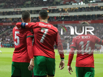 Diogo Dalot , Cristiano Ronaldo , Pedro Neto  during UEFA Nations League match Poland vs Portugal in Warsaw Poland on 12 October 2024. (