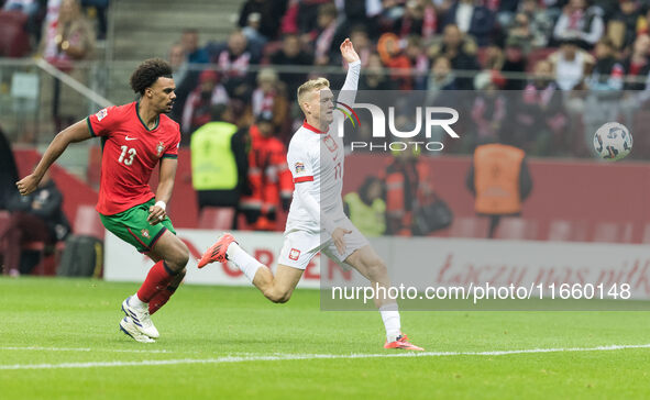 Renato Veiga , Karol Swiderski  during UEFA Nations League match Poland vs Portugal in Warsaw Poland on 12 October 2024. 