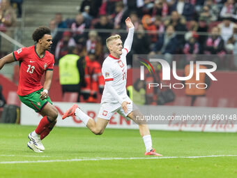 Renato Veiga , Karol Swiderski  during UEFA Nations League match Poland vs Portugal in Warsaw Poland on 12 October 2024. (