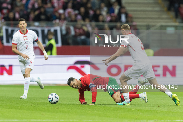 Cristiano Ronaldo , Pawel Dawidowicz  during UEFA Nations League match Poland vs Portugal in Warsaw Poland on 12 October 2024. 