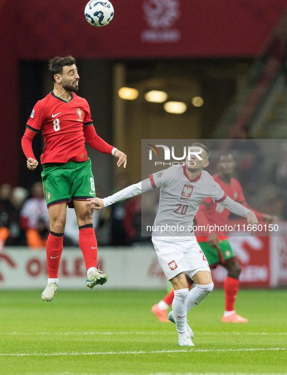 Bruno Fernandes , Sebastian Szymanski  during UEFA Nations League match Poland vs Portugal in Warsaw Poland on 12 October 2024. 