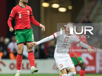 Bruno Fernandes , Sebastian Szymanski  during UEFA Nations League match Poland vs Portugal in Warsaw Poland on 12 October 2024. (