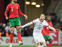 Bruno Fernandes , Sebastian Szymanski  during UEFA Nations League match Poland vs Portugal in Warsaw Poland on 12 October 2024. (