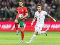 Ruben Dias , Robert Lewandowski  during UEFA Nations League match Poland vs Portugal in Warsaw Poland on 12 October 2024. (