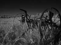 An abandoned seed spreader sits rusting on the plains of Fall River, South Dakota, USA. (