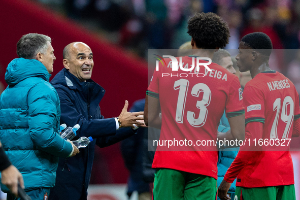 Roberto Martínez is talks to Renato Veiga and Nuno Mendes during the  UEFA Nations League 2024 League A Group A1 match between Poland and Po...