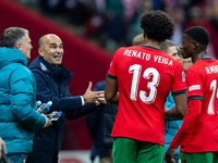 Roberto Martínez is talks to Renato Veiga and Nuno Mendes during the  UEFA Nations League 2024 League A Group A1 match between Poland and Po...