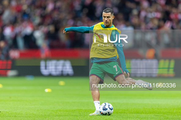 Cristiano Ronaldo warms up before  the  UEFA Nations League 2024 League A Group A1 match between Poland and Portugal , at the PGE Narodowy i...