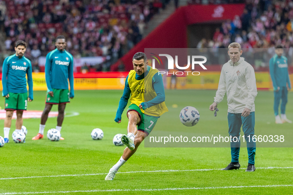 Cristiano Ronaldo warms up before  the  UEFA Nations League 2024 League A Group A1 match between Poland and Portugal , at the PGE Narodowy i...