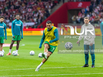 Cristiano Ronaldo warms up before  the  UEFA Nations League 2024 League A Group A1 match between Poland and Portugal , at the PGE Narodowy i...