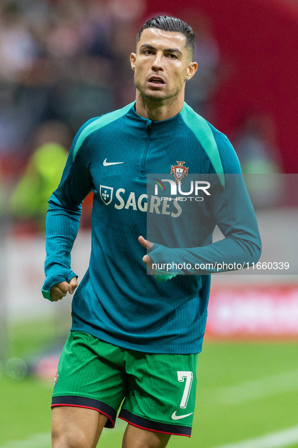 Cristiano Ronaldo warms up before  the  UEFA Nations League 2024 League A Group A1 match between Poland and Portugal , at the PGE Narodowy i...