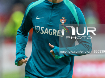 Cristiano Ronaldo warms up before  the  UEFA Nations League 2024 League A Group A1 match between Poland and Portugal , at the PGE Narodowy i...