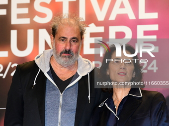 Portrait of actor Gustave Kervern and a woman at the opening night of the Lumiere festival in Lyon, France, on October 12, 2024. (