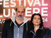 Portrait of actor Gustave Kervern and a woman at the opening night of the Lumiere festival in Lyon, France, on October 12, 2024. (