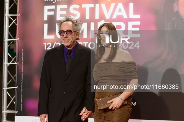 Monica Bellucci and Tim Burton attend the opening night of the Lumiere festival in Lyon, France, on October 12, 2024. 