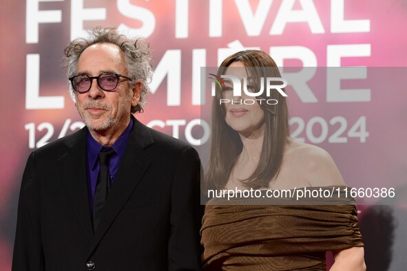 Monica Bellucci and Tim Burton attend the opening night of the Lumiere festival in Lyon, France, on October 12, 2024. 