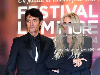 Portrait of actor Gulio Base and an actress at the opening night of the Lumiere festival in Lyon, France, on October 12, 2024. (