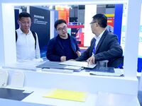 Visitors communicate with exhibitors at the 9th China Advanced Materials Industry Expo 2024 in Qingdao, China, on October 12, 2024. (