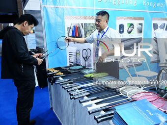 Visitors communicate with exhibitors at the 9th China Advanced Materials Industry Expo 2024 in Qingdao, China, on October 12, 2024. (