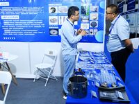 Visitors communicate with exhibitors at the 9th China Advanced Materials Industry Expo 2024 in Qingdao, China, on October 12, 2024. (