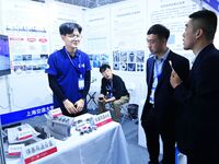 Visitors look at new materials and products at the 9th China Advanced Materials Industry Expo 2024 in Qingdao, China, on October 12, 2024. (