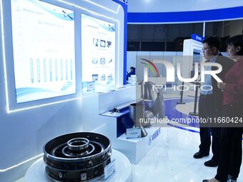 Visitors look at new materials and products at the 9th China Advanced Materials Industry Expo 2024 in Qingdao, China, on October 12, 2024. (