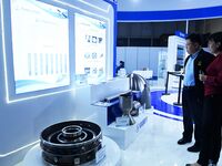 Visitors look at new materials and products at the 9th China Advanced Materials Industry Expo 2024 in Qingdao, China, on October 12, 2024. (