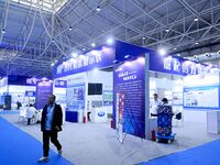 Visitors look at new materials and products at the 9th China Advanced Materials Industry Expo 2024 in Qingdao, China, on October 12, 2024. (