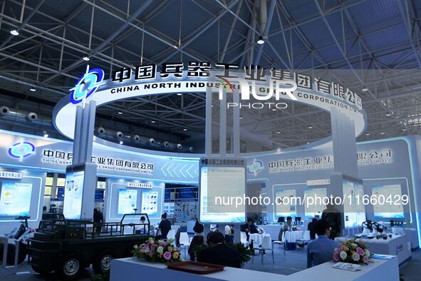 Visitors visit the booth of China North Industries Group Co LTD at the 9th China Advanced Materials Industry Expo 2024 in Qingdao, China, on...