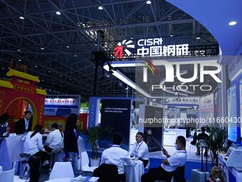 Visitors visit the booth of China Steel Research at the 9th China Advanced Materials Industry Expo 2024 in Qingdao, China, on October 12, 20...