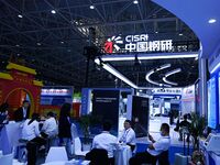 Visitors visit the booth of China Steel Research at the 9th China Advanced Materials Industry Expo 2024 in Qingdao, China, on October 12, 20...