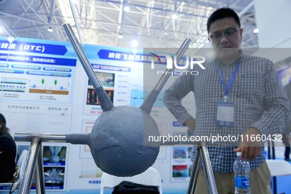 An exhibitor introduces anti-corrosion materials at the 9th China Advanced Materials Industry Expo 2024 in Qingdao, China, on October 12, 20...