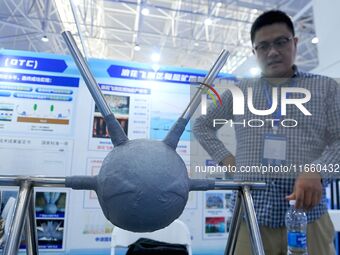 An exhibitor introduces anti-corrosion materials at the 9th China Advanced Materials Industry Expo 2024 in Qingdao, China, on October 12, 20...