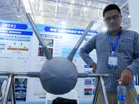 An exhibitor introduces anti-corrosion materials at the 9th China Advanced Materials Industry Expo 2024 in Qingdao, China, on October 12, 20...