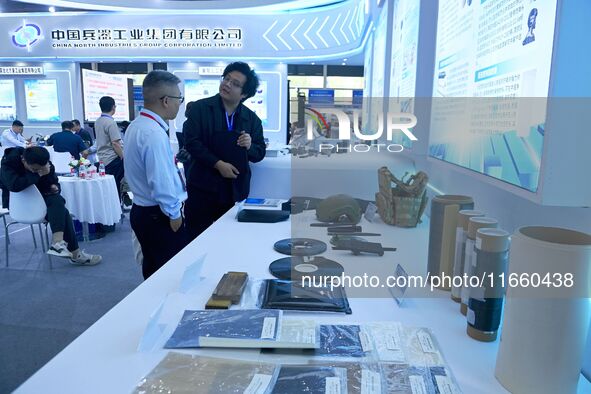 Visitors look at new materials and products at the 9th China Advanced Materials Industry Expo 2024 in Qingdao, China, on October 12, 2024. 