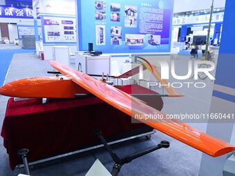 An exhibitor shows a target machine at the 9th China Advanced Materials Industry Expo 2024 in Qingdao, China, on October 12, 2024. (