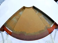 An exhibitor displays a section of Chang'e-5 anti-thermal insulation material at the 9th China Advanced Materials Industry Expo 2024 in Qing...