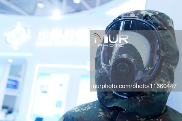 An exhibitor displays personal wear and protective equipment at the 9th China Advanced Materials Industry Expo 2024 in Qingdao, China, on Oc...