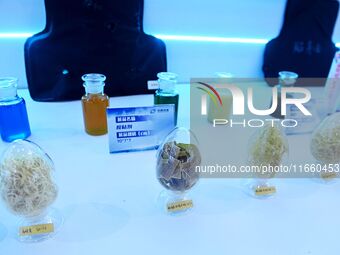 An exhibitor displays adhesive materials at the 9th China Advanced Materials Industry Expo 2024 in Qingdao, China, on October 12, 2024. (