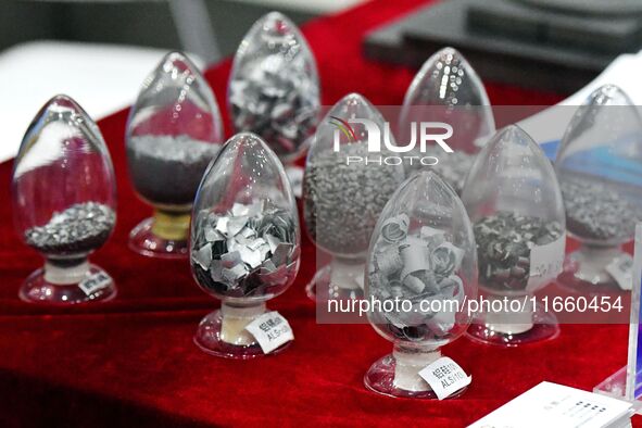 An exhibitor displays metal additives at the 9th China Advanced Materials Industry Expo 2024 in Qingdao, China, on October 12, 2024. 