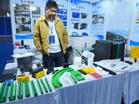 An exhibitor displays new nuclear energy materials at the 9th China Advanced Materials Industry Expo 2024 in Qingdao, China, on October 12,...