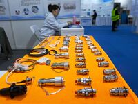 An exhibitor shows a dual-use connector at the 9th China Advanced Materials Industry Expo 2024 in Qingdao, China, on October 12, 2024. (