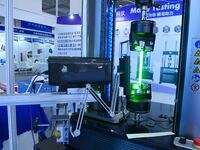 An exhibitor displays mechanical material testing equipment at the 9th China Advanced Materials Industry Expo 2024 in Qingdao, China, on Oct...