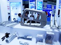 An exhibitor displays magnesium alloys and products at the 9th China Advanced Materials Industry Expo 2024 in Qingdao, China, on October 12,...