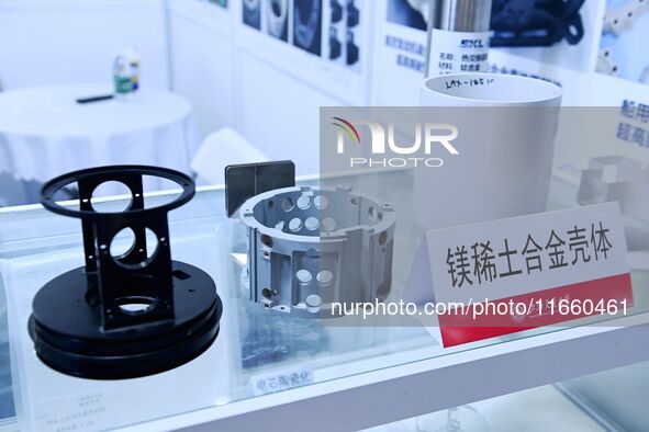 An exhibitor displays magnesium rare earth alloy materials at the 9th China Advanced Materials Industry Expo 2024 in Qingdao, China, on Octo...