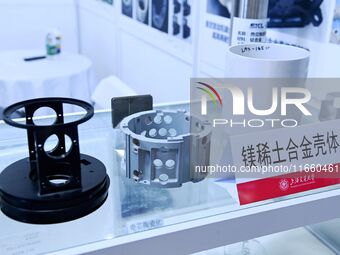 An exhibitor displays magnesium rare earth alloy materials at the 9th China Advanced Materials Industry Expo 2024 in Qingdao, China, on Octo...